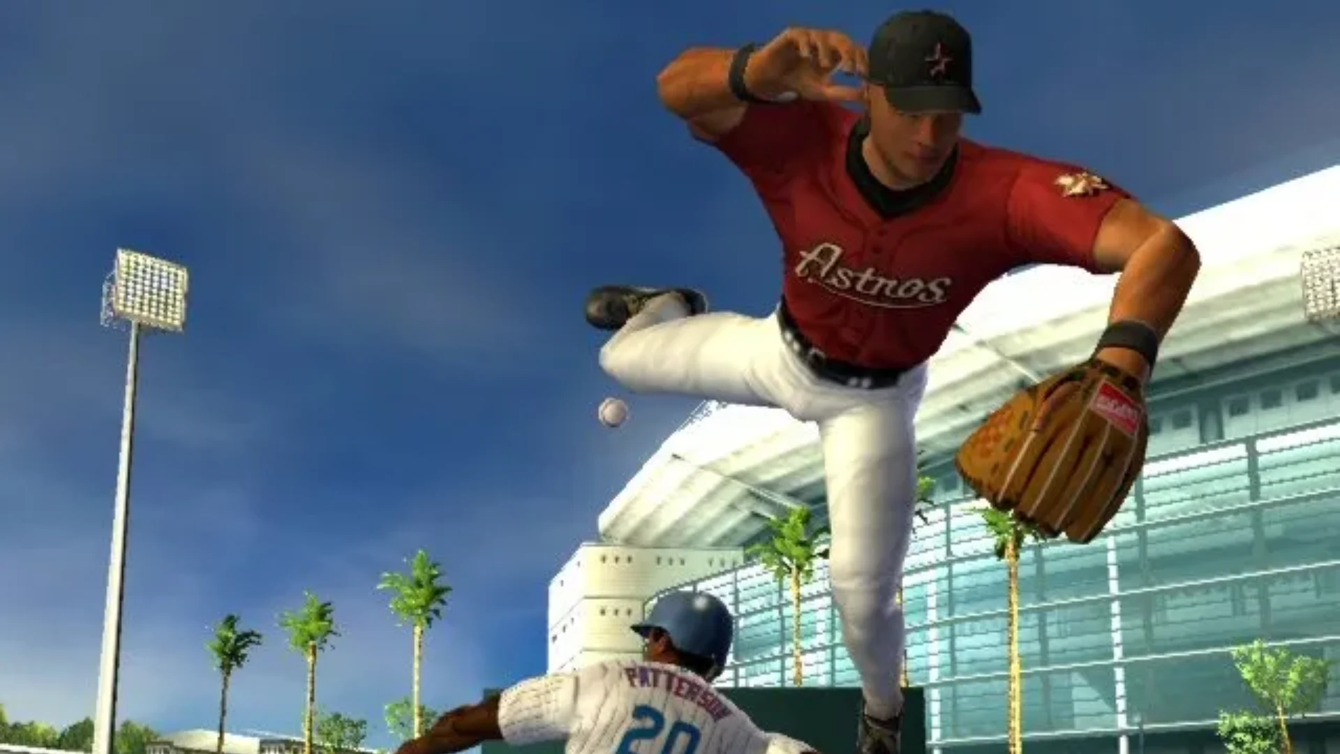 MVP Baseball 2005 gameplay showing a fielder leaping over a sliding runner while making a defensive play.
