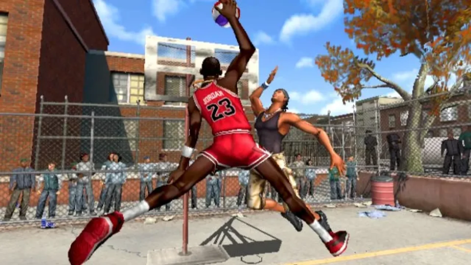 NBA Street Vol. 2 gameplay showing a player in a red number 23 jersey driving toward the basket over a defender.