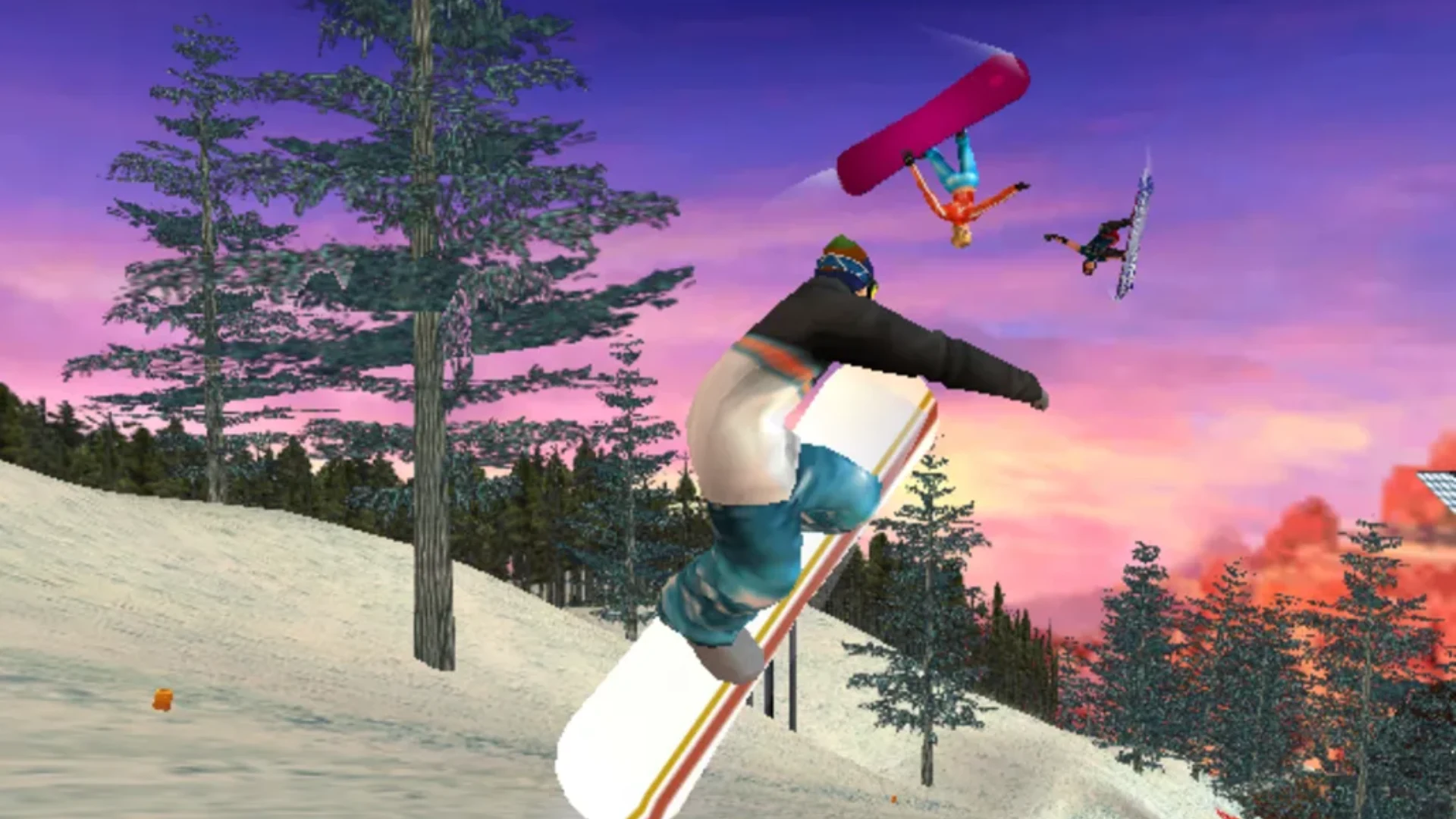 SSX Tricky gameplay showing three snowboarders performing aerial tricks above a snowy slope at sunset.