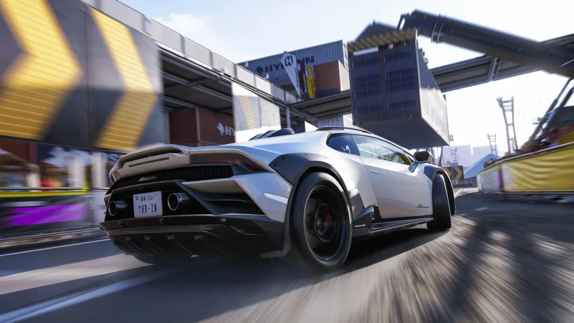 A white Lamborghini races through a fast urban track in Forza Horizon 6.