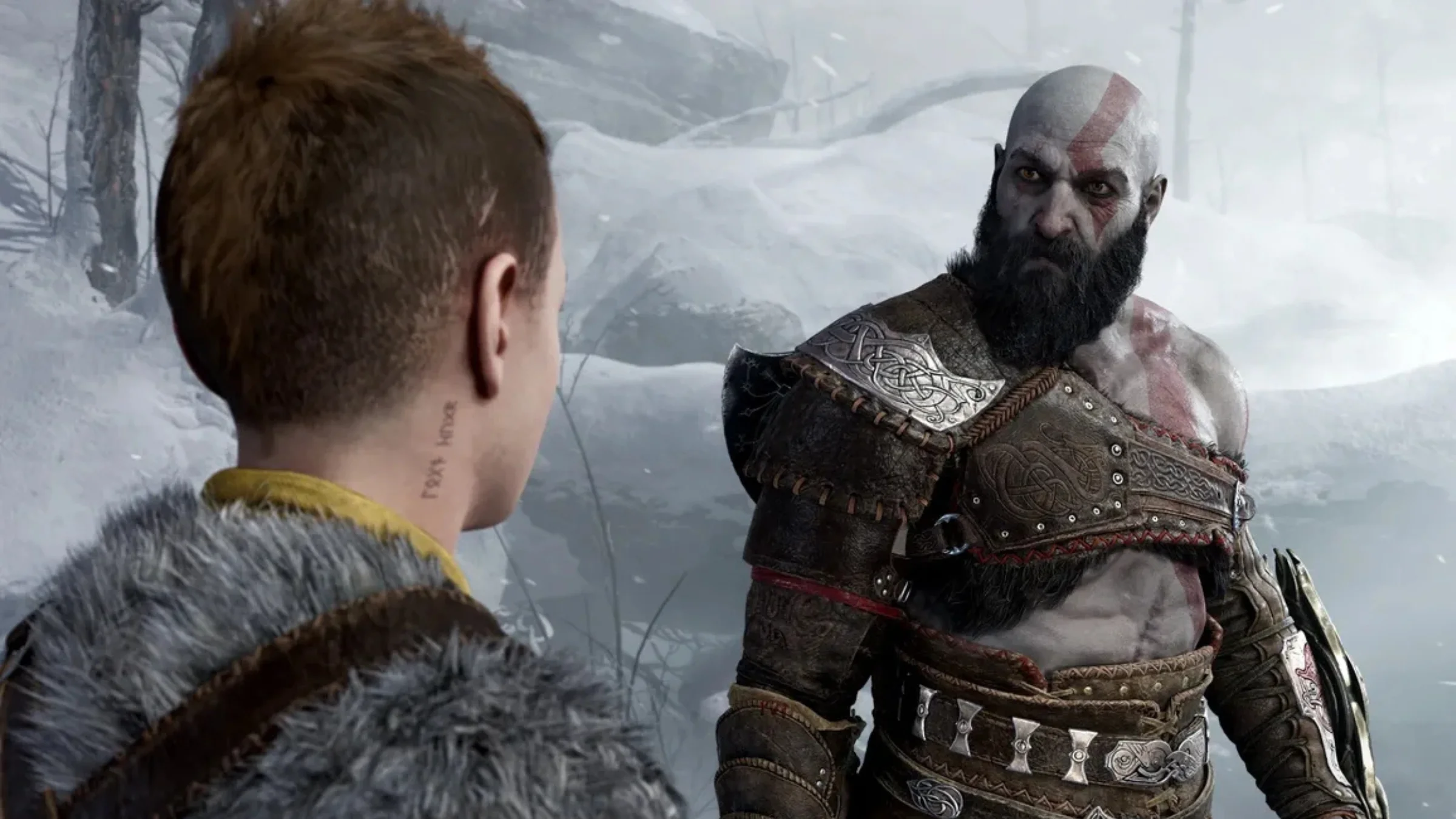 Kratos faces Atreus in a snowy forest scene from God of War.