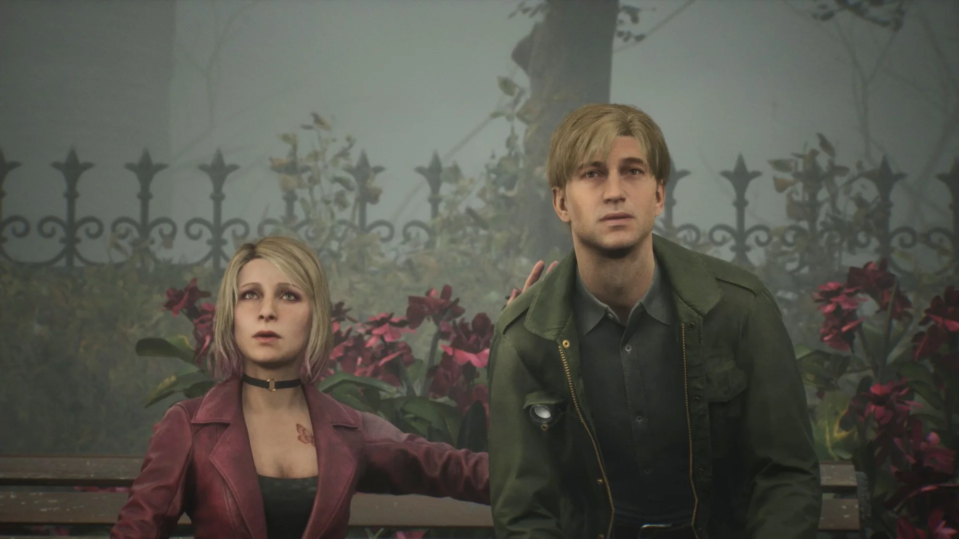 James and Maria sit in a foggy garden scene from Silent Hill 2