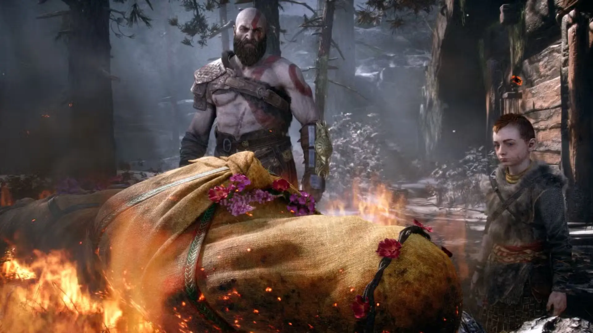 Kratos and Atreus prepare Faye's funeral pyre at the beginning of God of War (2018)