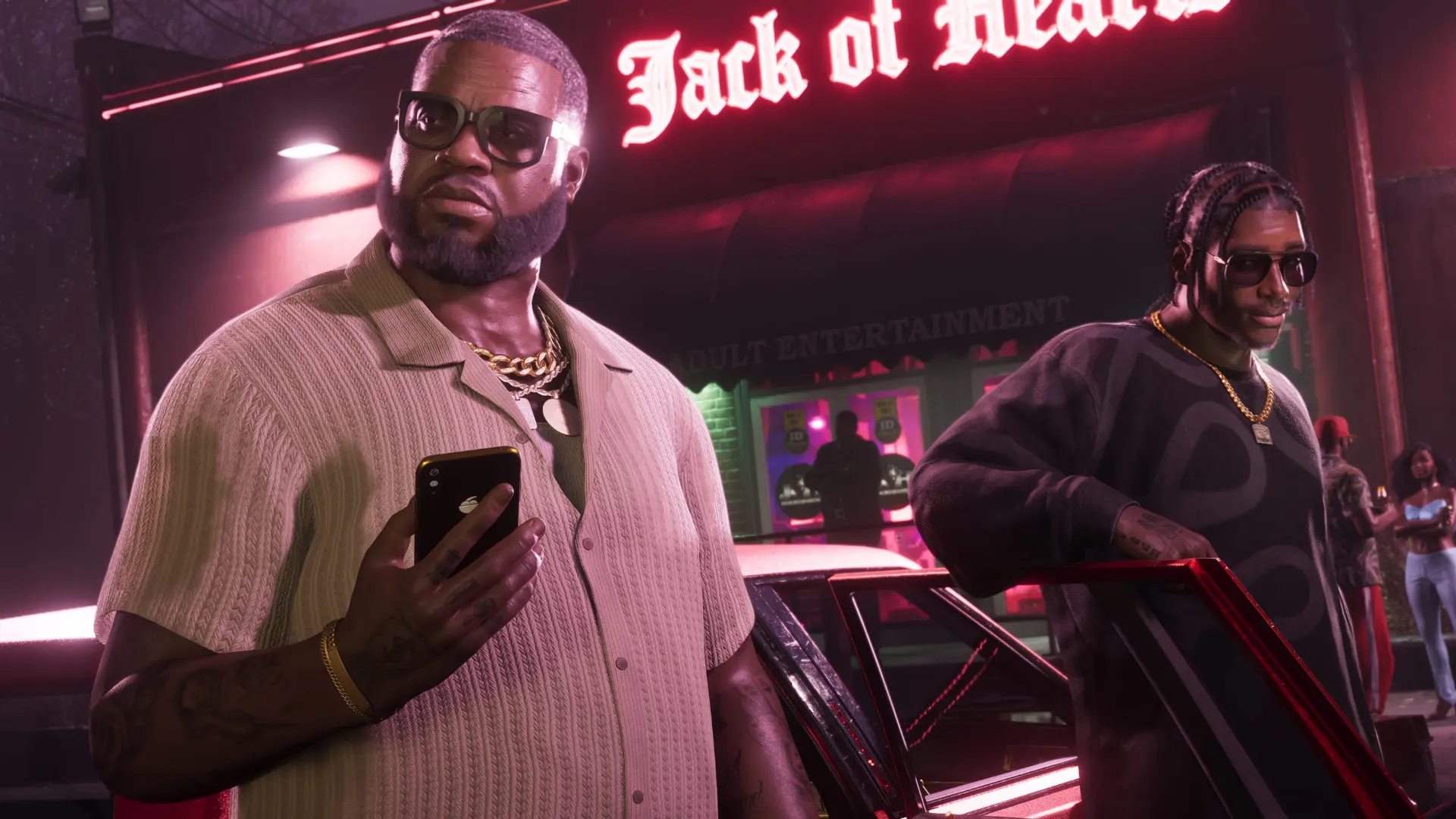 Two characters stand outside the Jack of Hearts club at night in Grand Theft Auto VI, surrounded by neon lights and luxury cars.
