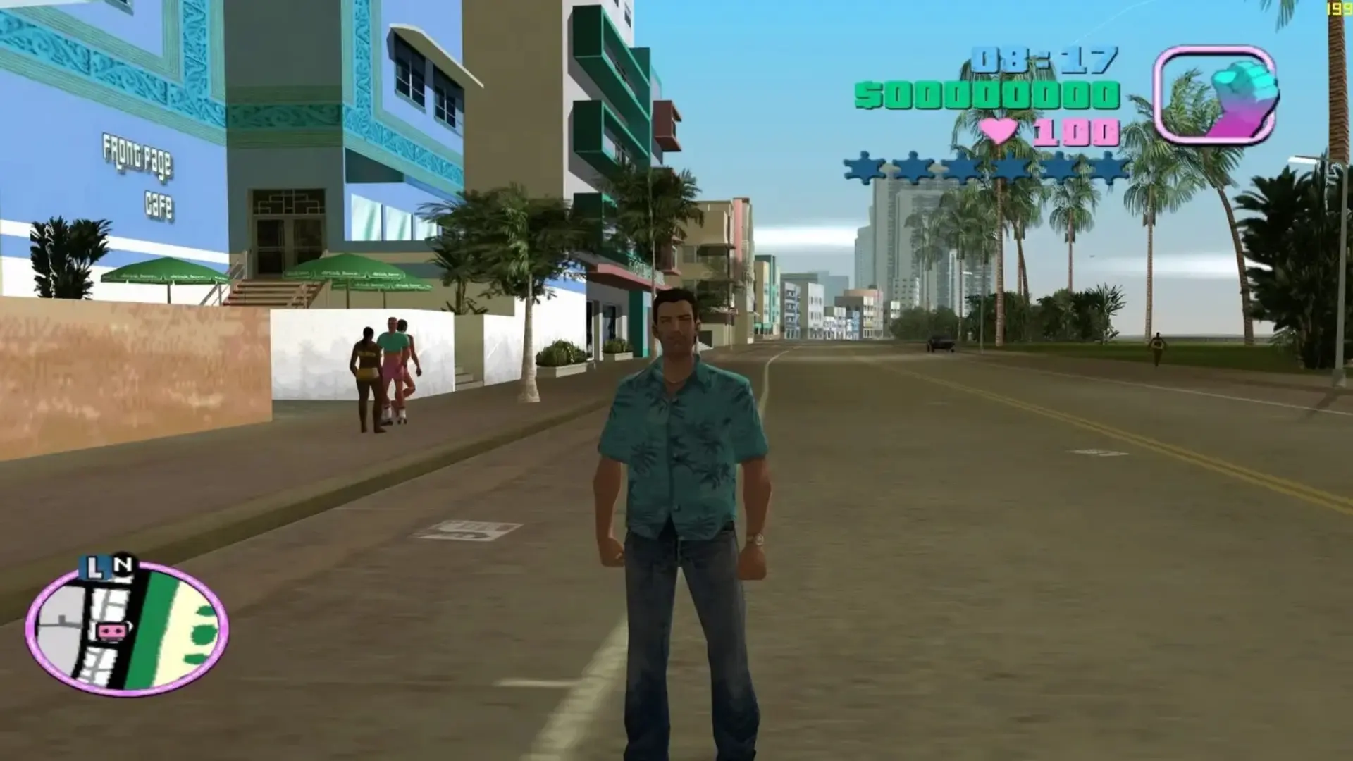 Tommy Vercetti stands on a palm-lined street in Vice City in Grand Theft Auto: Vice City.