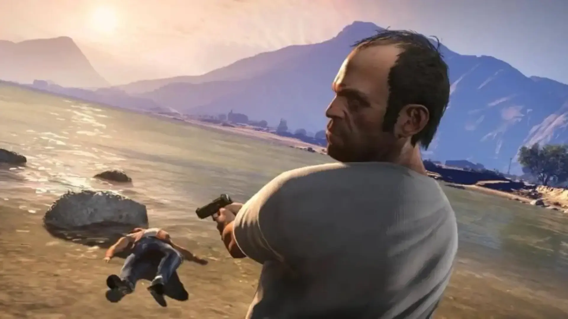 Trevor Philips aiming a pistol on a lakeshore after a confrontation in Grand Theft Auto V