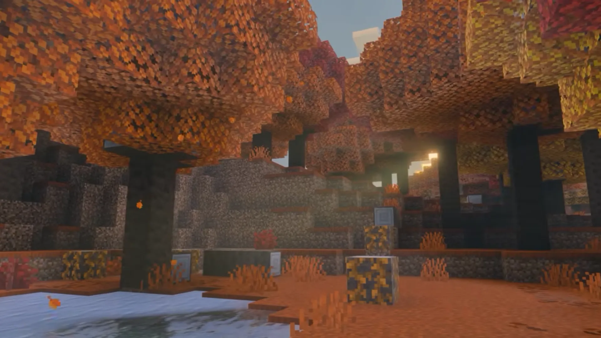 A Minecraft Dappled Forest filled with orange trees, dark trunks, mushrooms and warm evening light.