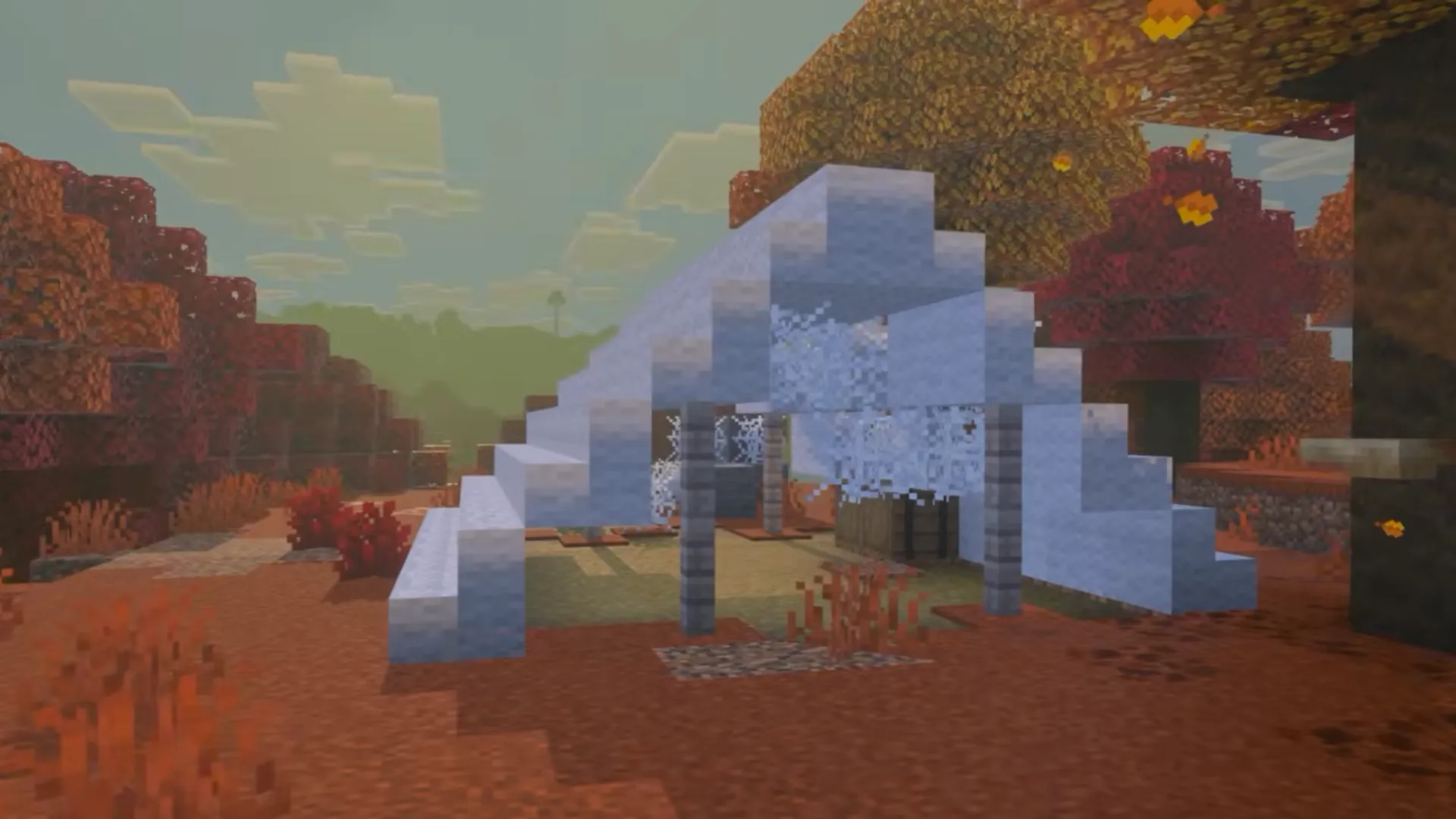 An abandoned Minecraft campsite with a white tent under autumn trees in the Dappled Forest.
