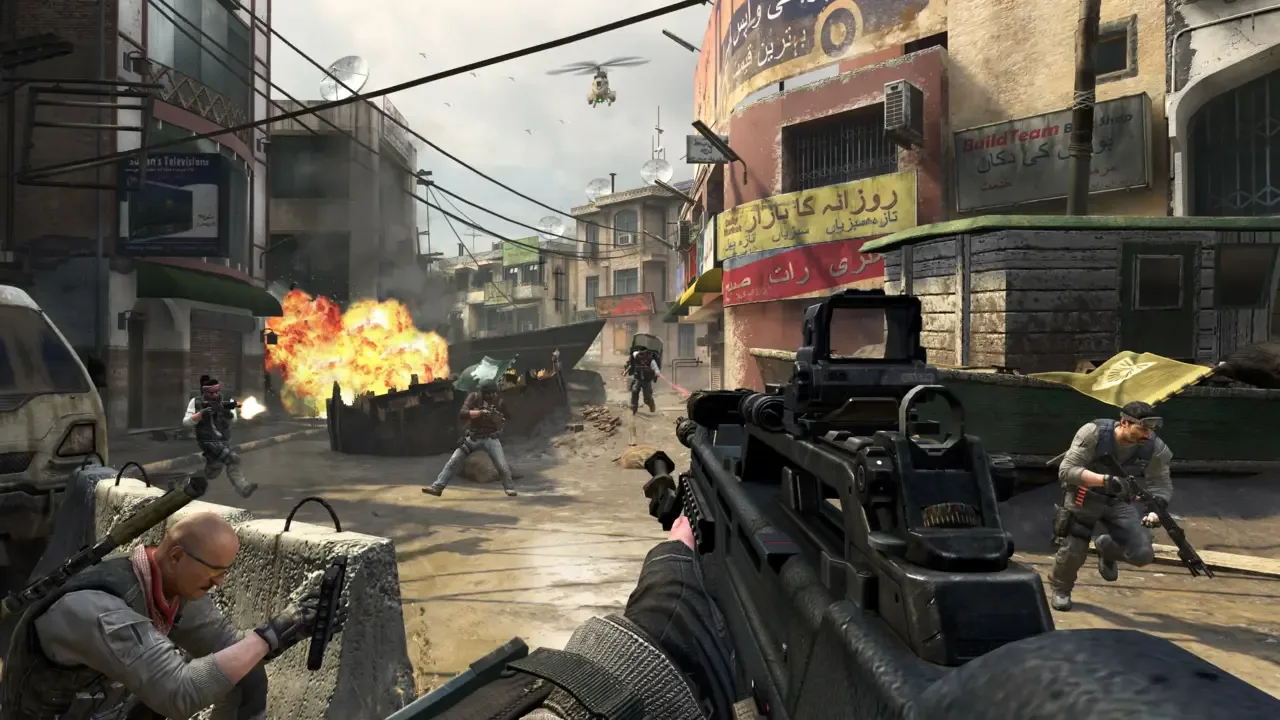 First-person firefight on an urban multiplayer map in Call of Duty: Black Ops 2, with soldiers, an explosion, and a helicopter in the background.