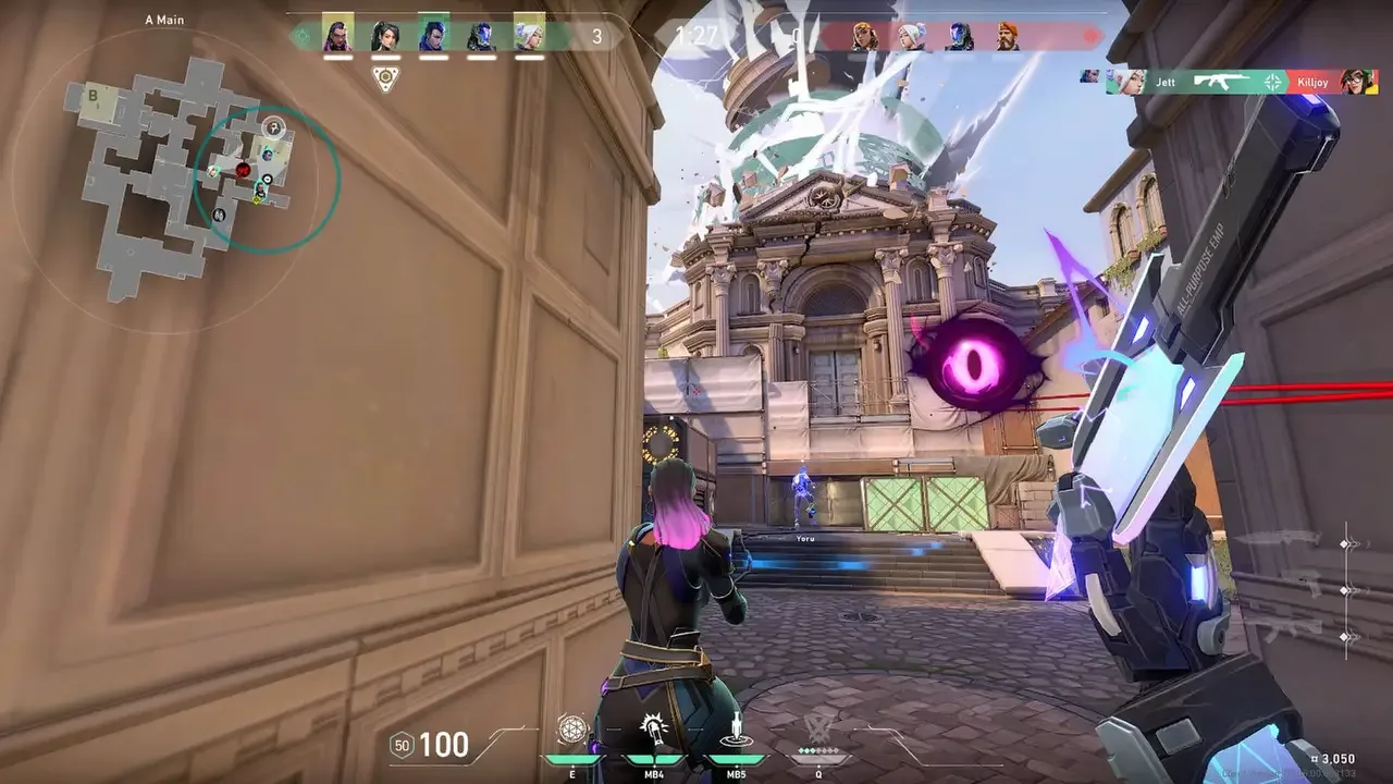 Valorant gameplay showing a player reloading while teammates push toward A Main beneath a floating purple eye ability.