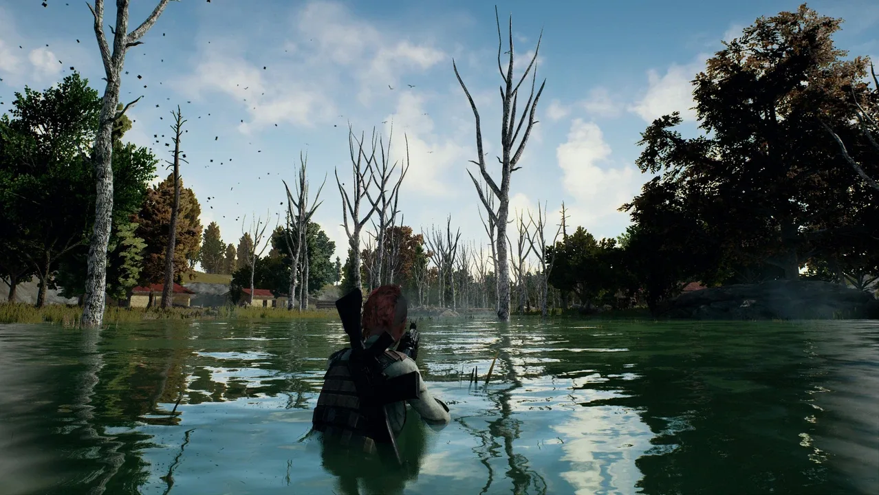 An armed PUBG: Battlegrounds player wading through a flooded forest with a rifle.