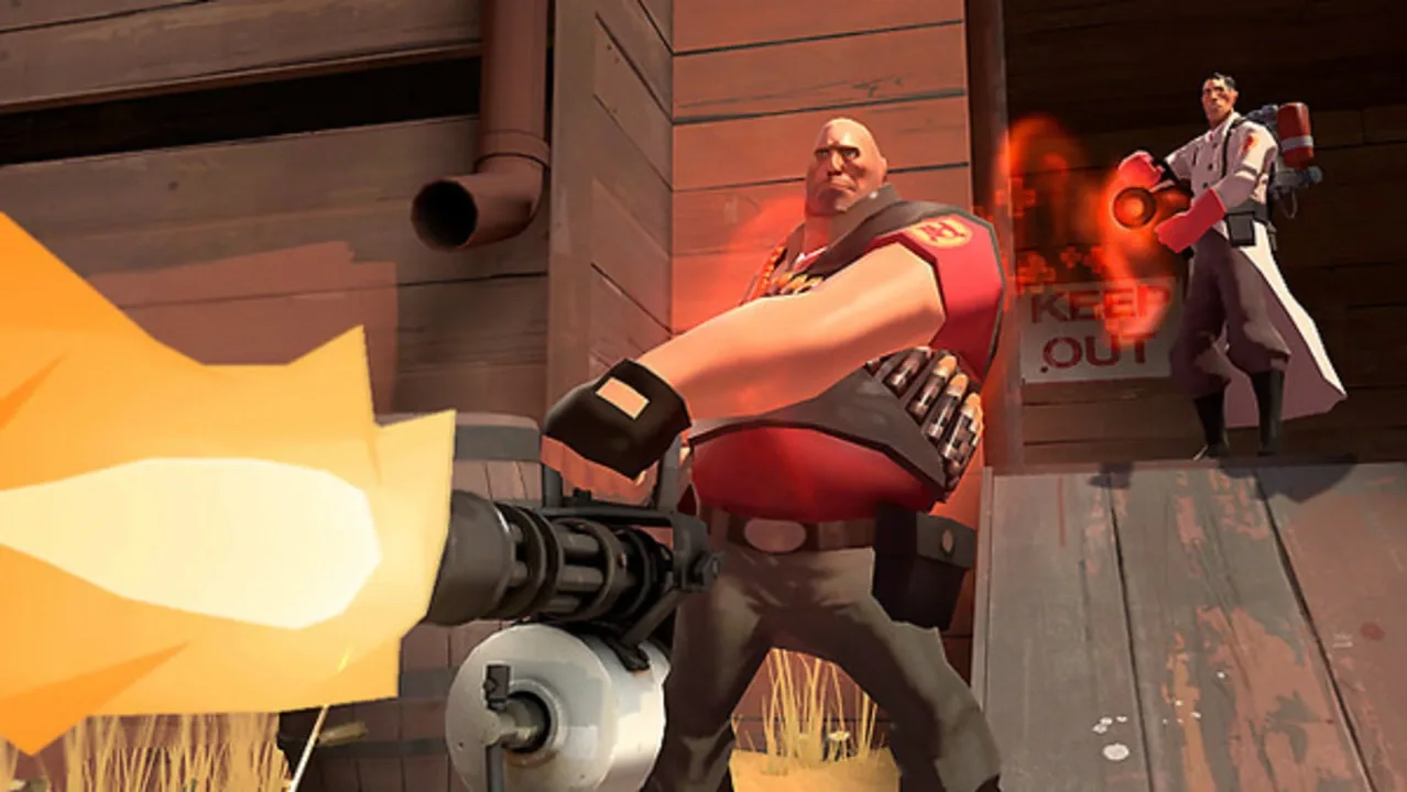 Heavy firing his minigun while Medic supports him during a battle in Team Fortress 2.