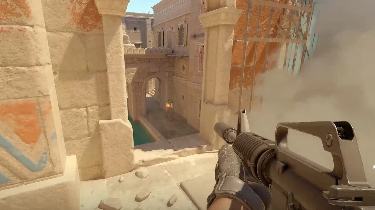 Counter-Strike 2 player aiming an M4 rifle through smoke on a desert-themed map.