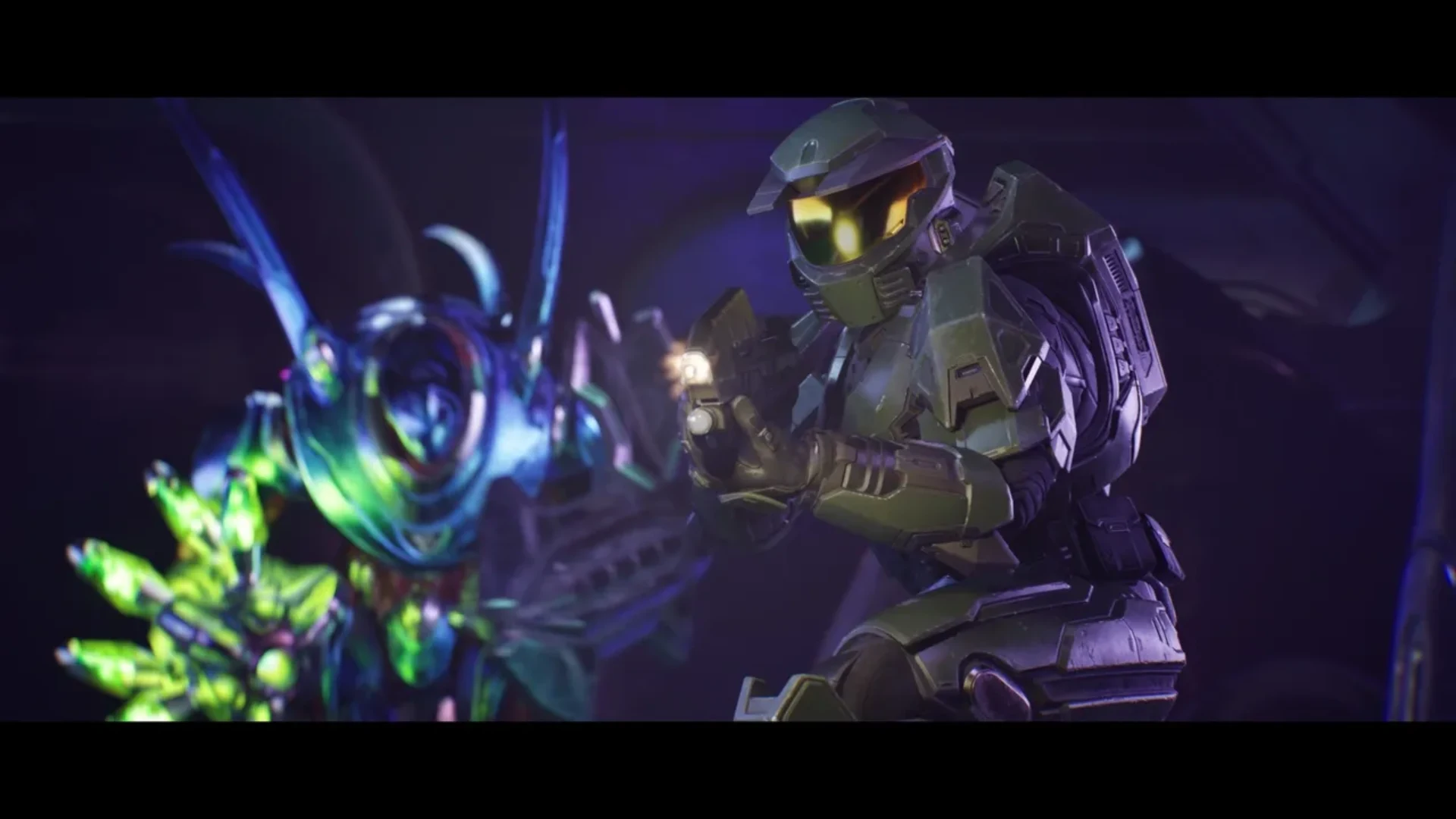 Master Chief aiming a pistol beside a glowing Covenant enemy in Halo: Campaign Evolved