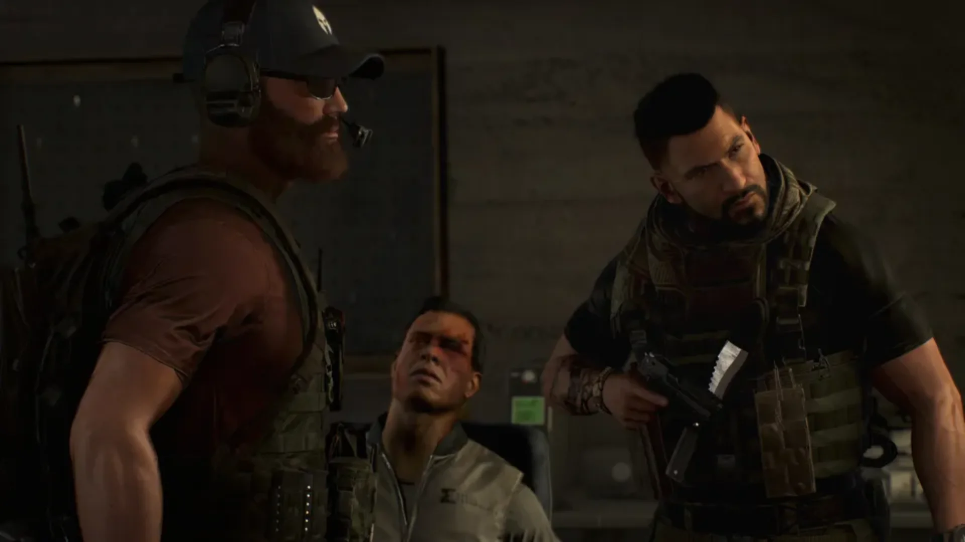 Ghost Recon Wildlands soldiers question a captive during a tense indoor mission scene.