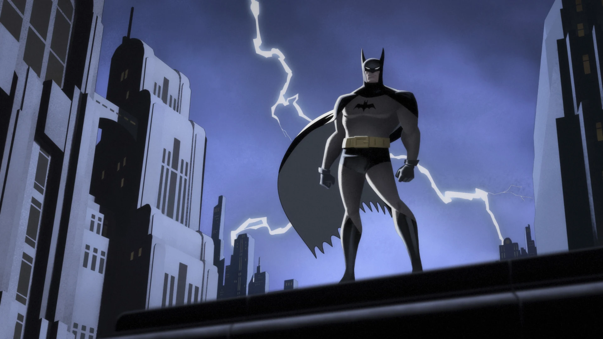 Batman standing on a Gotham rooftop with lightning behind him