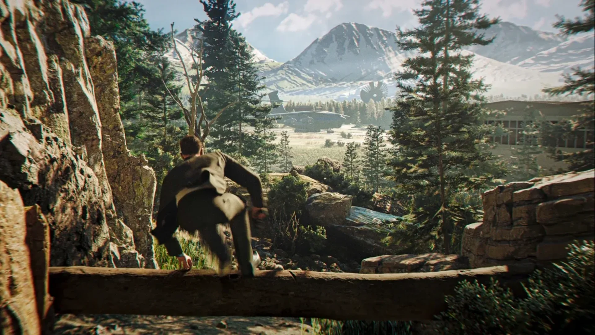A character climbs through a forest while approaching a mountain airfield in 007 First Light.