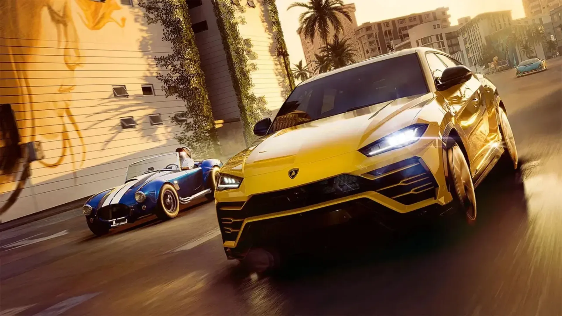 A yellow Lamborghini SUV races a blue classic roadster down a palm-lined street at sunset in The Crew Motorfest.