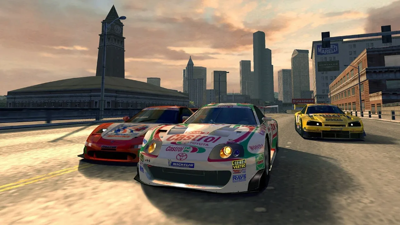 Three race cars compete on a city circuit at sunset in Gran Turismo 4.