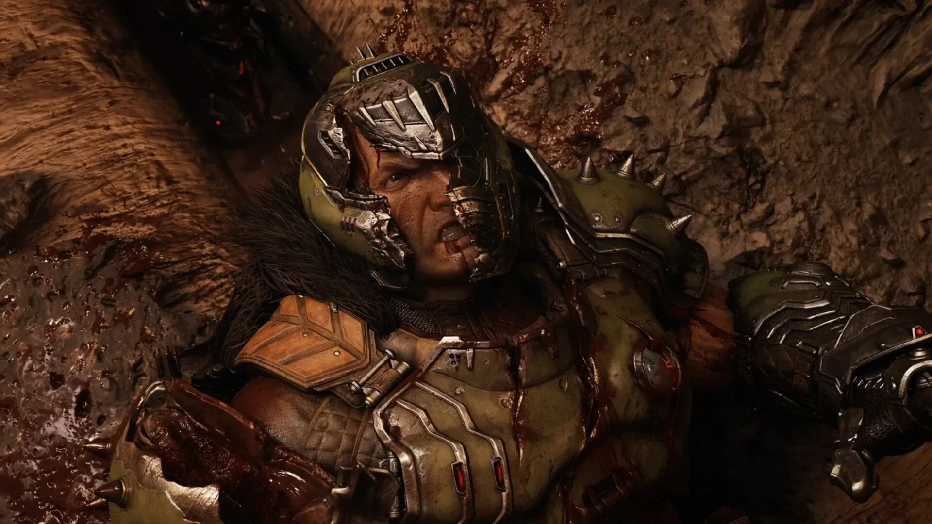 An injured Doom Slayer lies against a bloody wall in DOOM: The Dark Ages | Revelations.
