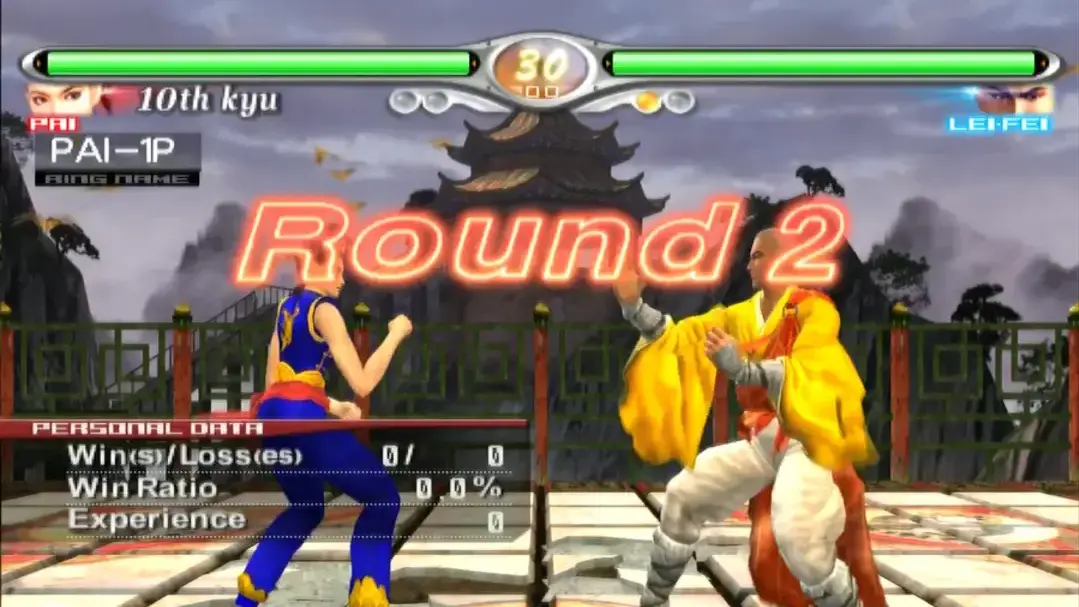 Pai Chan and Lei-Fei prepare to fight on a temple stage in Virtua Fighter 4: Evolution.