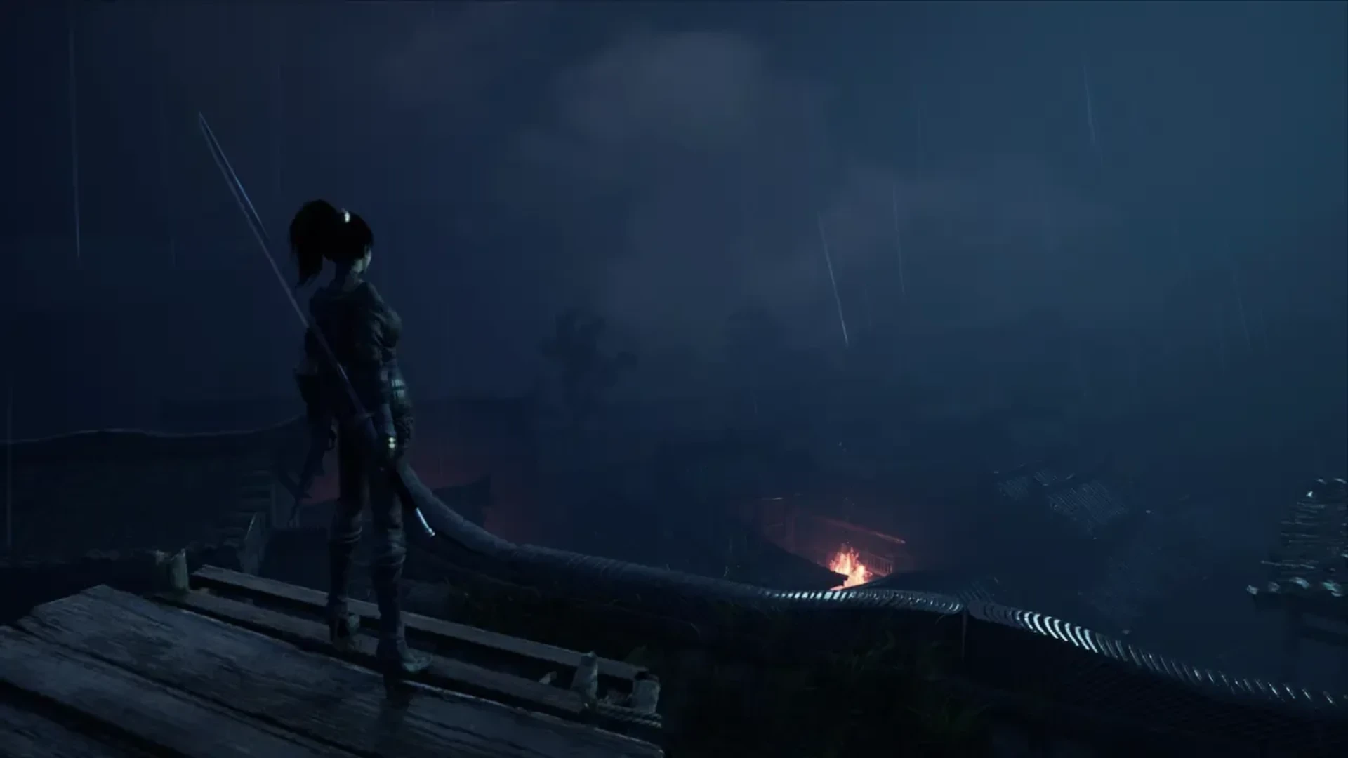 Bai Wuchang overlooks a dark village during heavy rain with fires burning below.