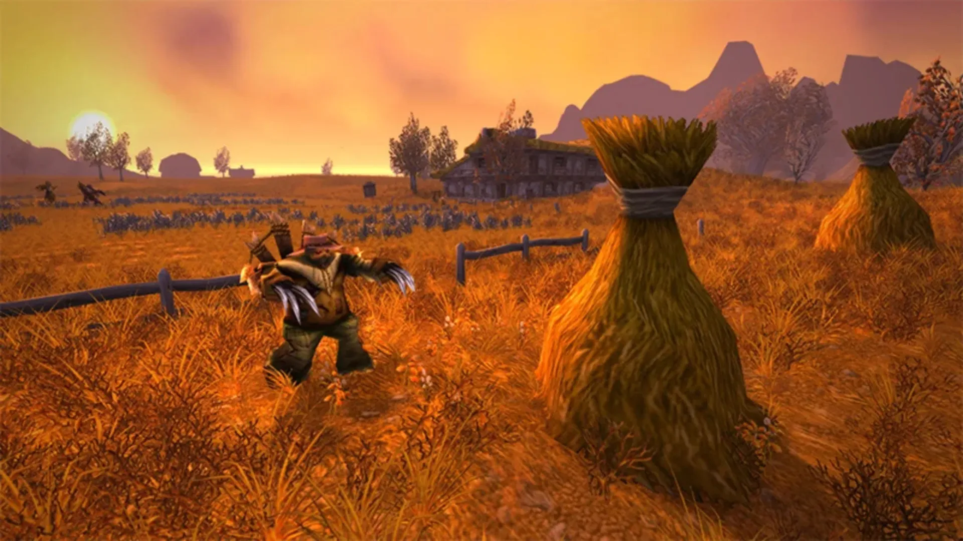 A gnome with claw weapons crouches in golden grain fields near haystacks and a farmhouse at sunset in WoW Classic.