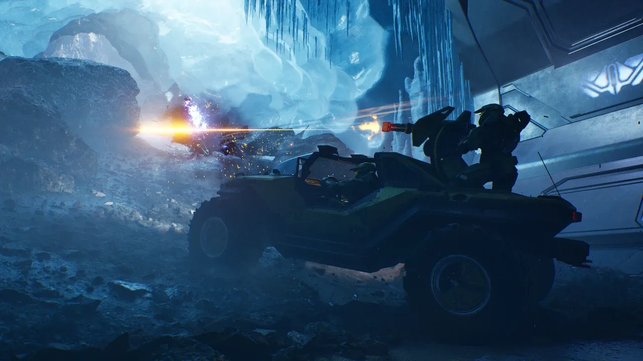 Master Chief and a UNSC Marine fire from a Warthog during a battle in an icy environment in Halo: Campaign Evolved.