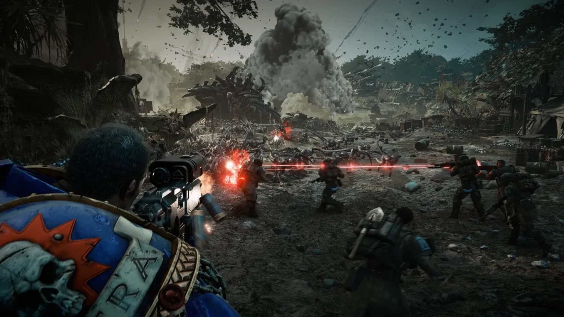 An Ultramarine fires into a large Tyranid swarm during a chaotic Space Marine 2 battle.