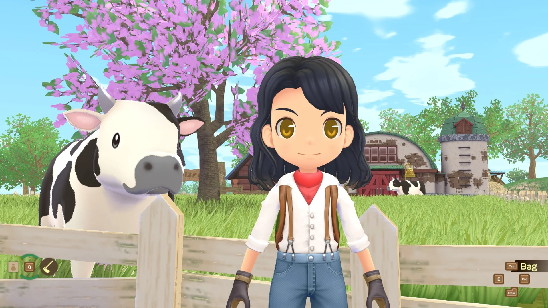 A Story of Seasons farmer stands beside a black-and-white cow near a barn and flowering tree.