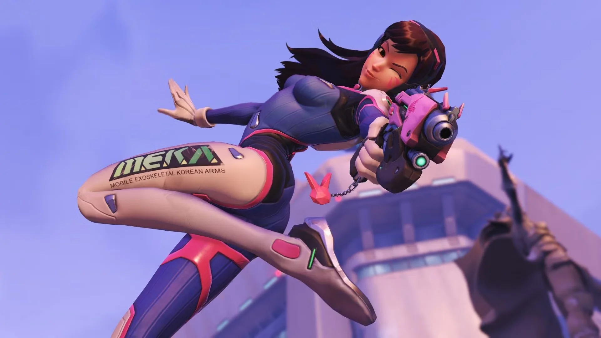 D.Va leaps through the air while aiming her pink Light Gun in an Overwatch gameplay scene.