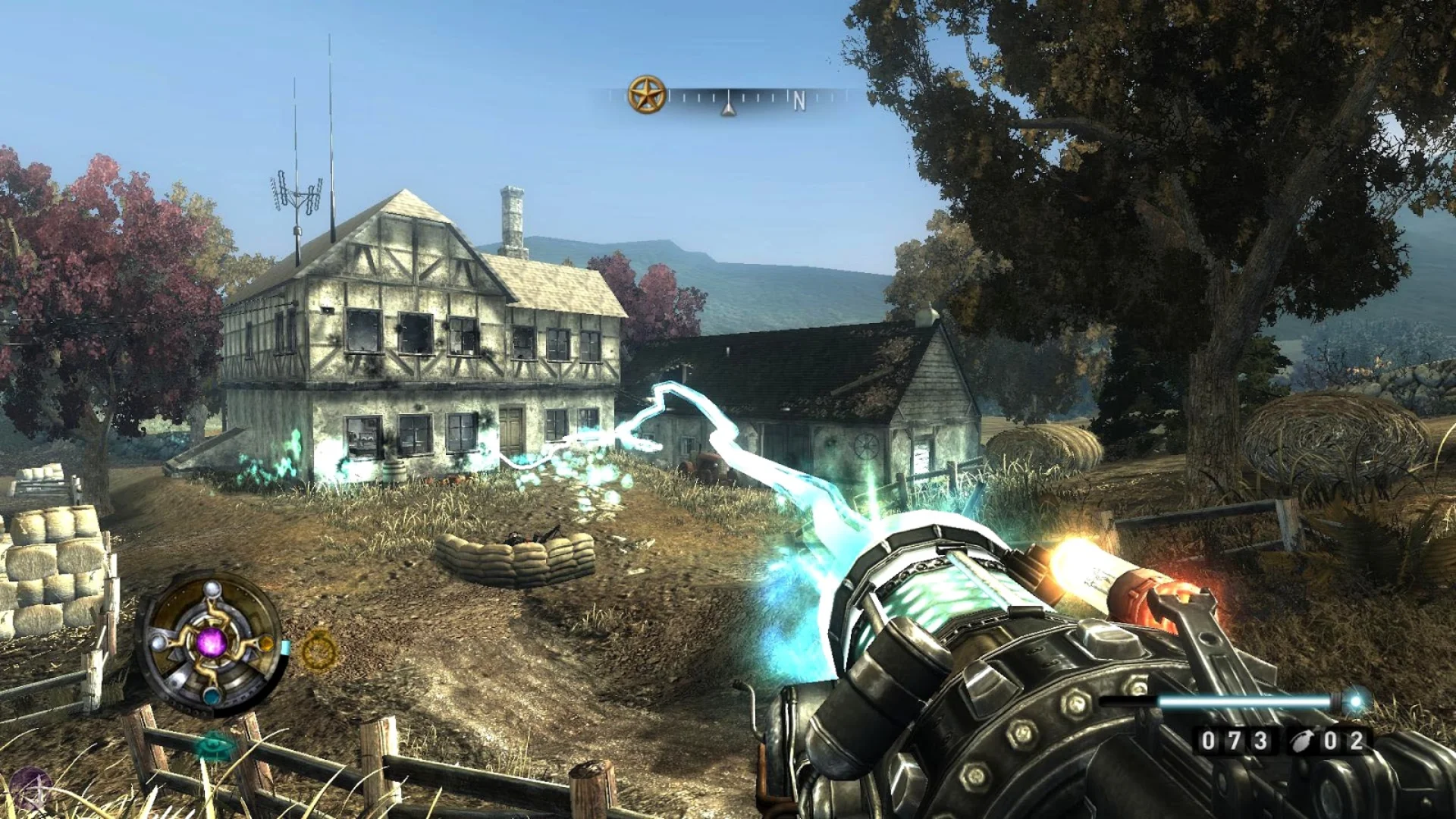 A player fires a blue energy weapon toward a rural farmhouse in Wolfenstein 2009 gameplay.