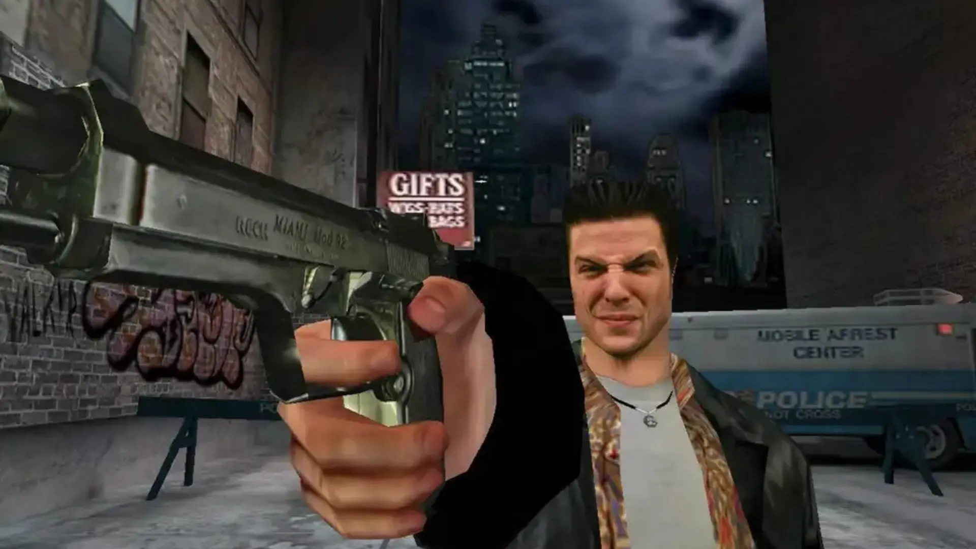 Max Payne aims a pistol on a snowy New York street at night.