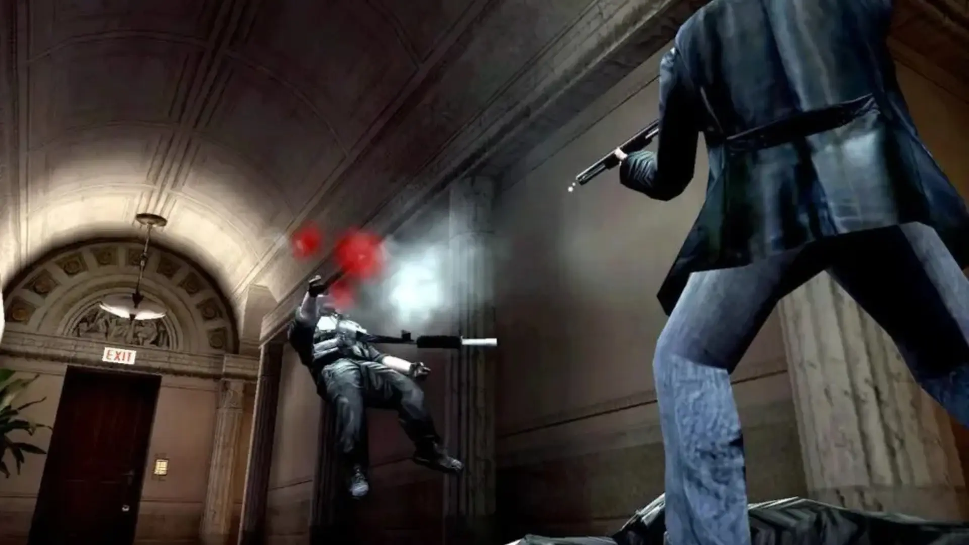 Max Payne fires at an armed enemy during a shootout inside a building.