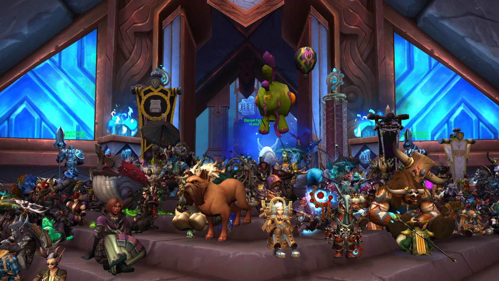 A large group of World of Warcraft player characters gathered inside a blue-lit hall.
