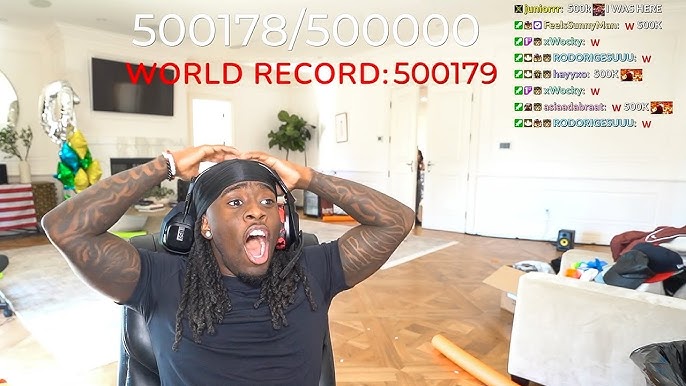 Kai Cenat celebrating after reaching 500,000 subscribers during a livestream