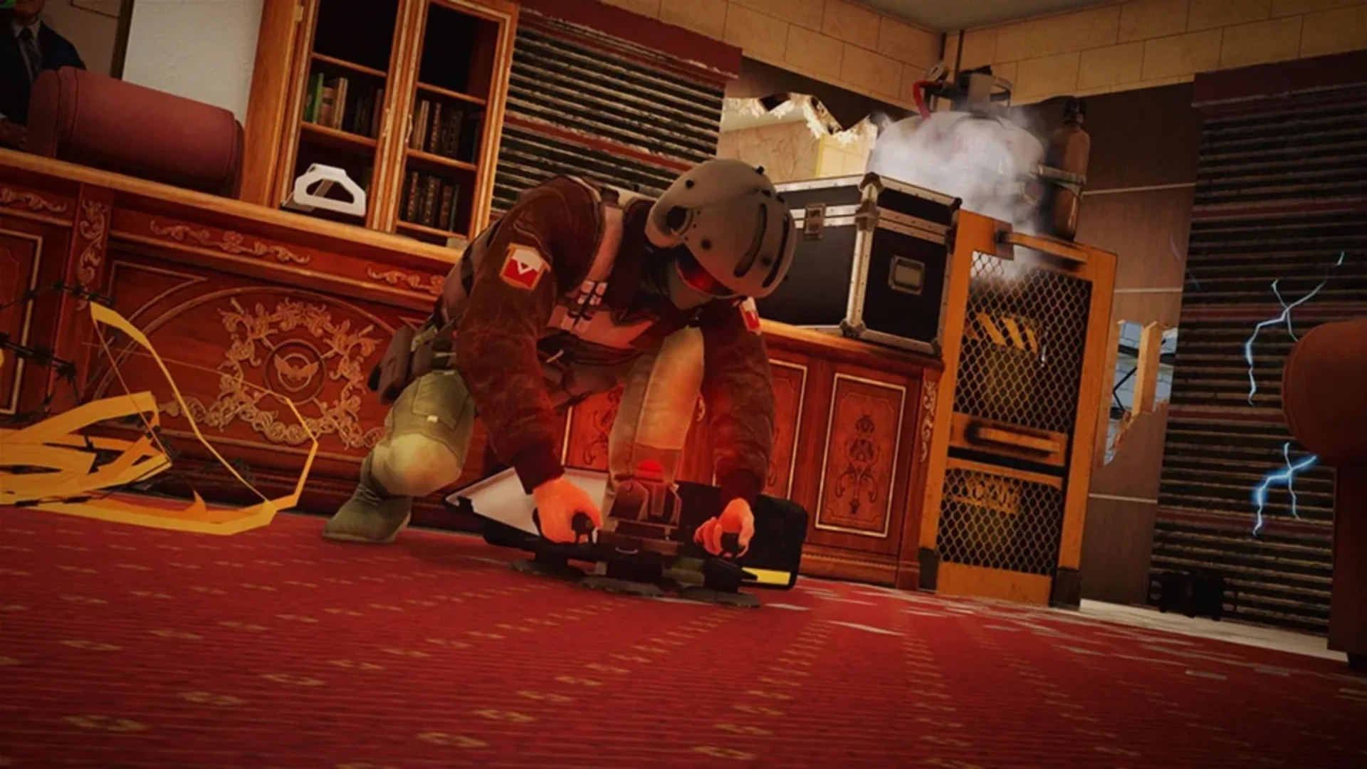 A Rainbow Six Mobile operator kneels to deploy tactical equipment inside a damaged room.