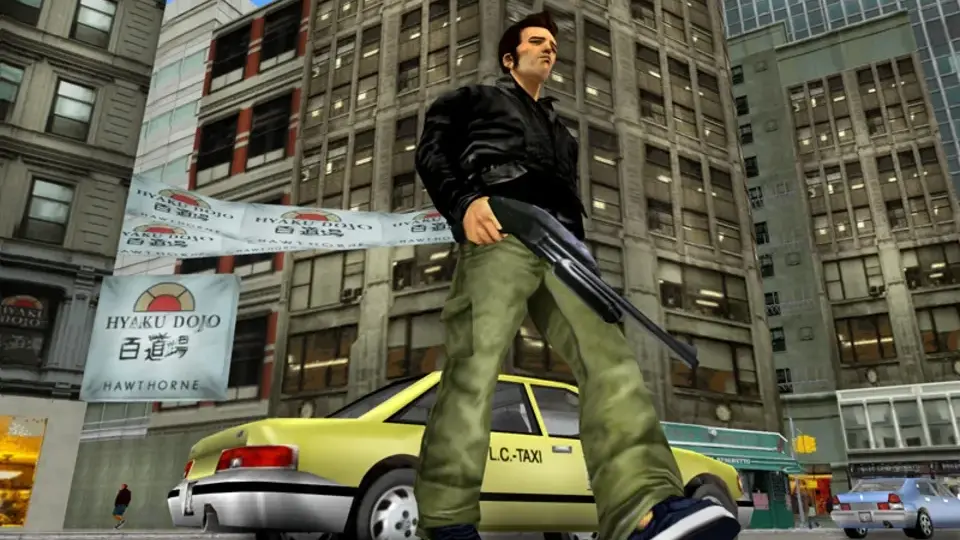 GTA III screenshot showing the protagonist standing with a shotgun on a city street in Liberty City.