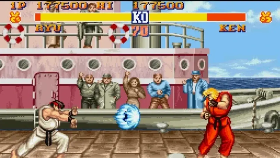 Street Fighter II screenshot showing Ryu and Ken fighting on a dock stage.