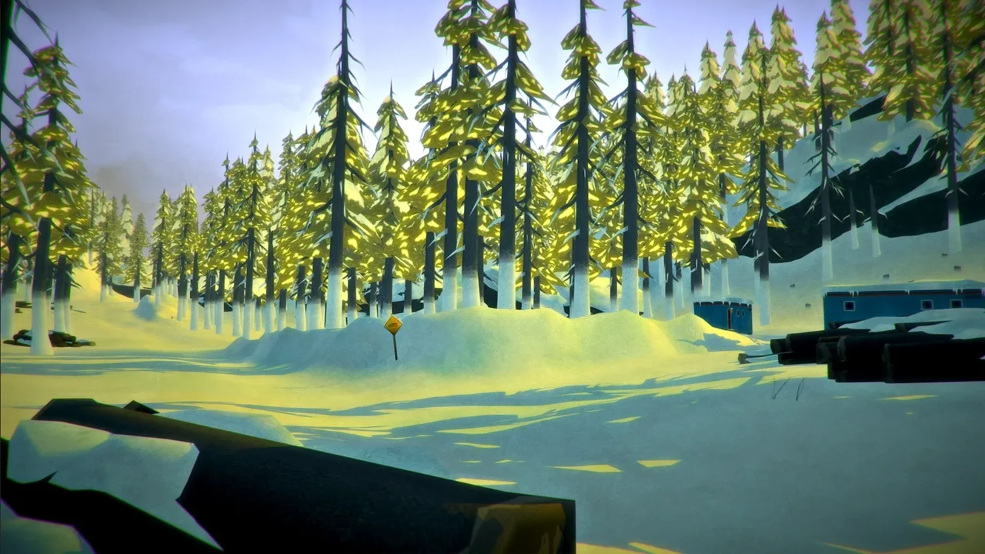 Snow-covered pine forest and road in the frozen wilderness of The Long Dark
