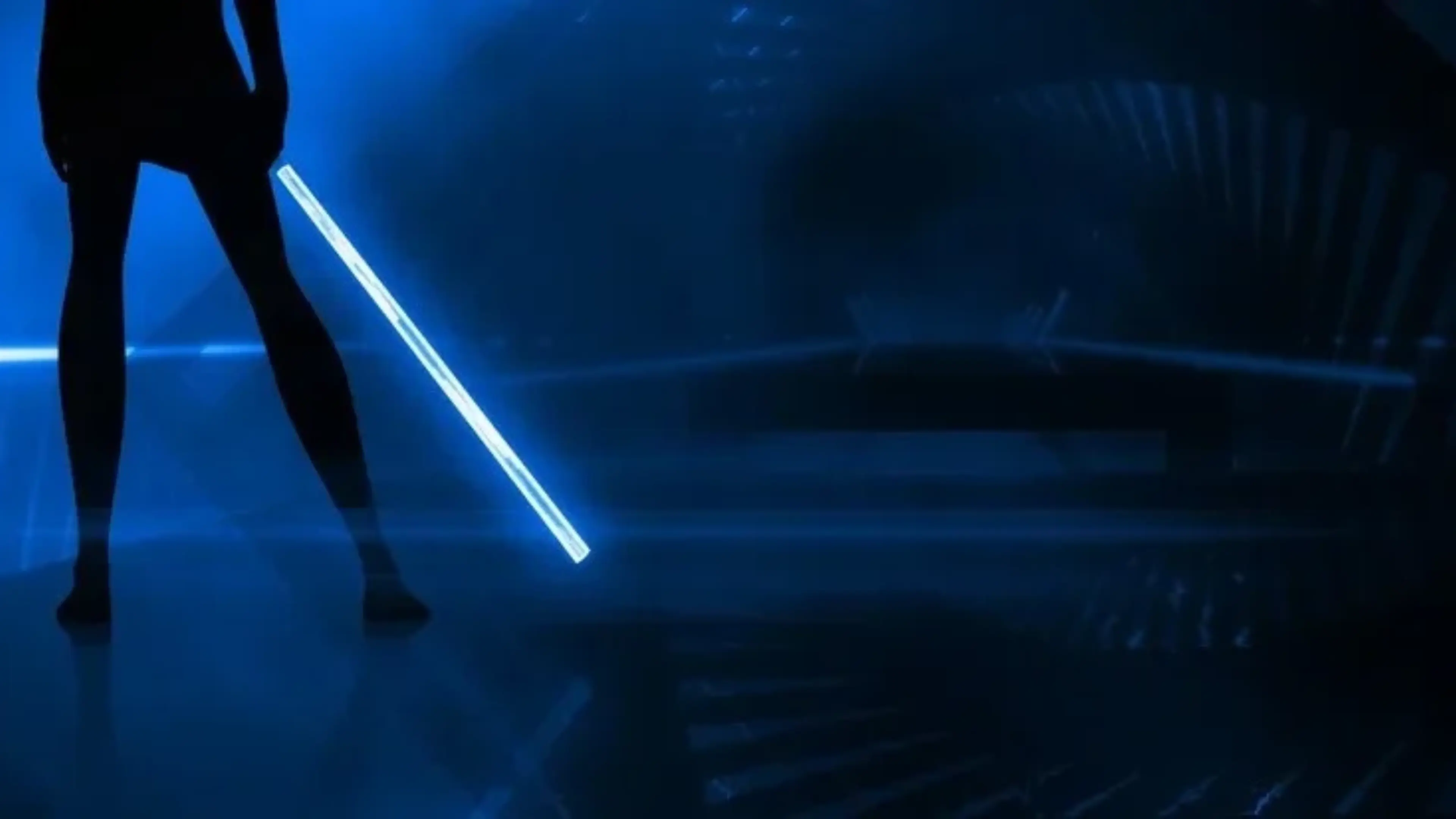 Player holds a glowing blue saber in Beat Saber