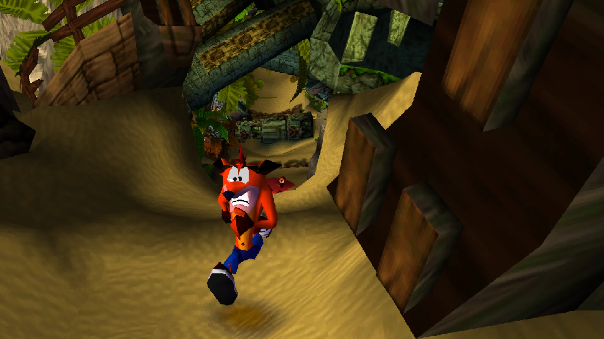 Crash Bandicoot running through a sandy jungle path in the original PS1 game