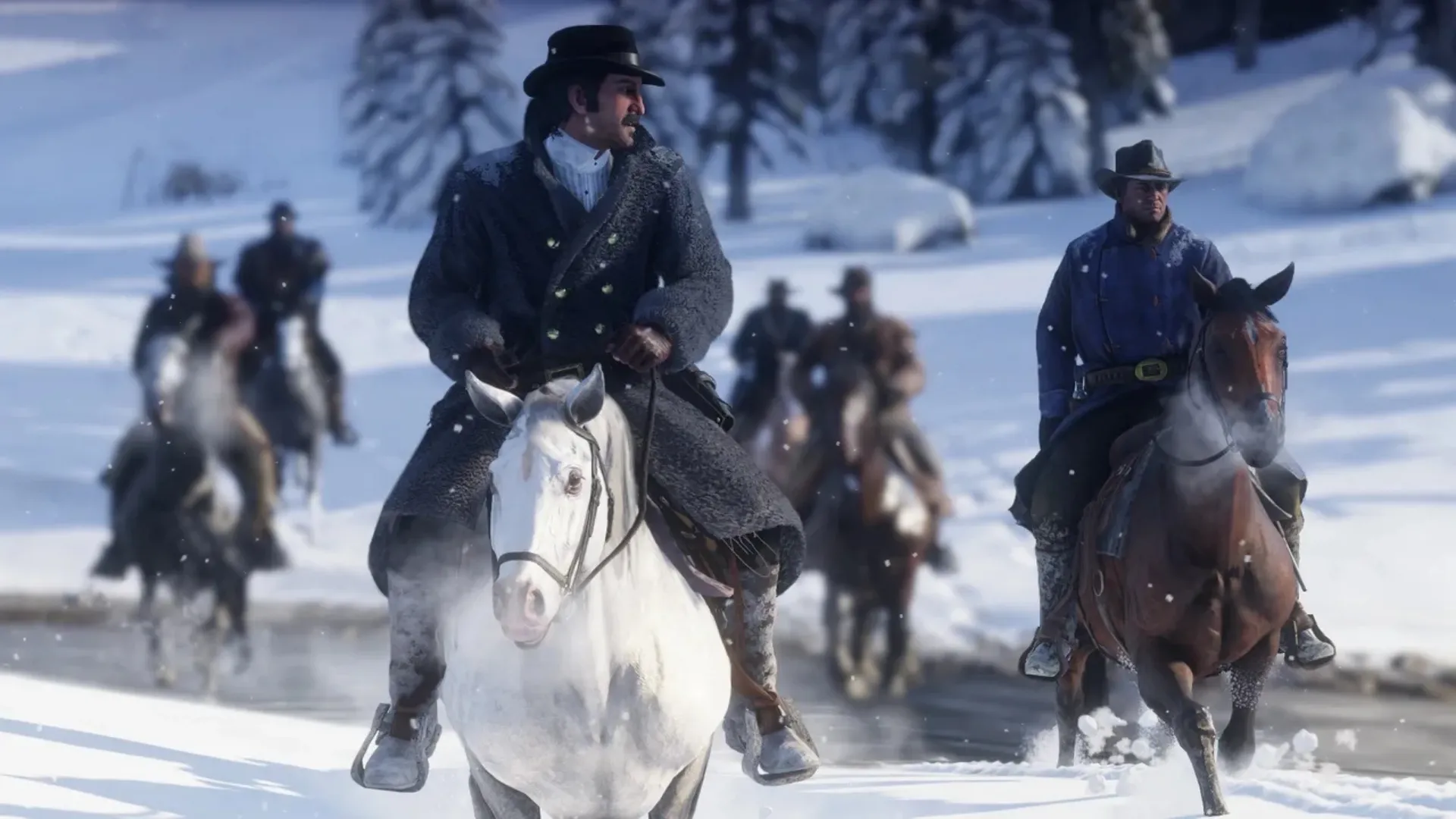 Dutch van der Linde and Arthur Morgan ride horses through deep snow in Red Dead Redemption 2.