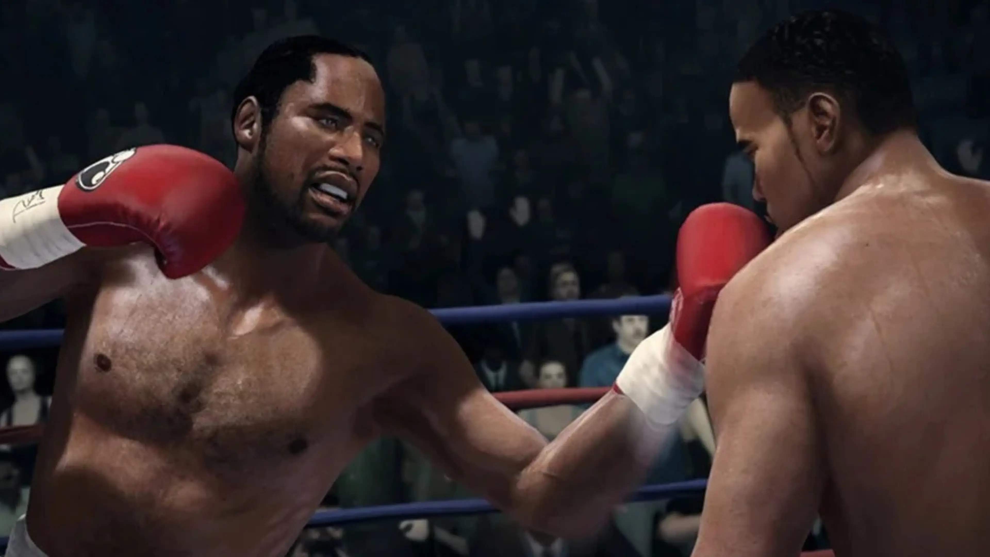 Two boxers exchange punches during a Fight Night Champion match
