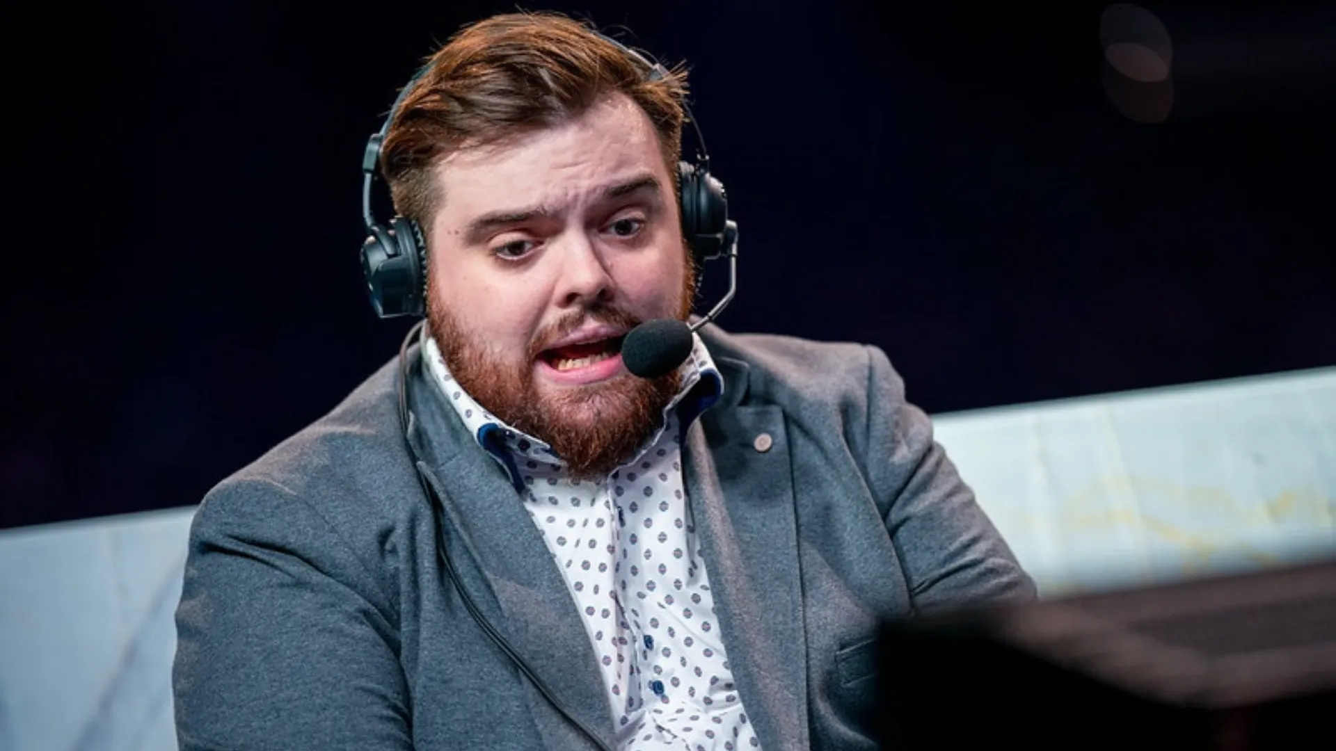 Close-up of Ibai Llanos wearing a headset while commentating at an esports event