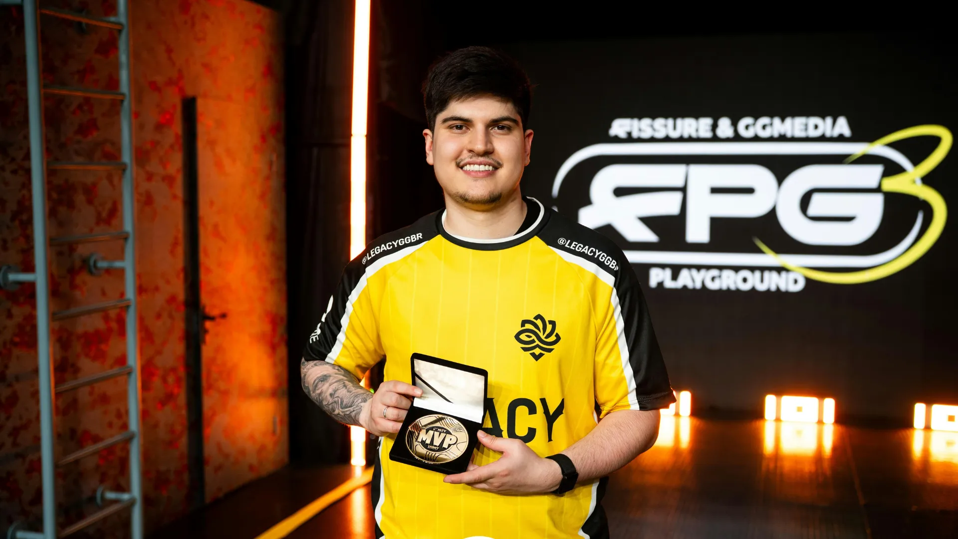 Legacy player holding the FISSURE Playground 3 MVP award