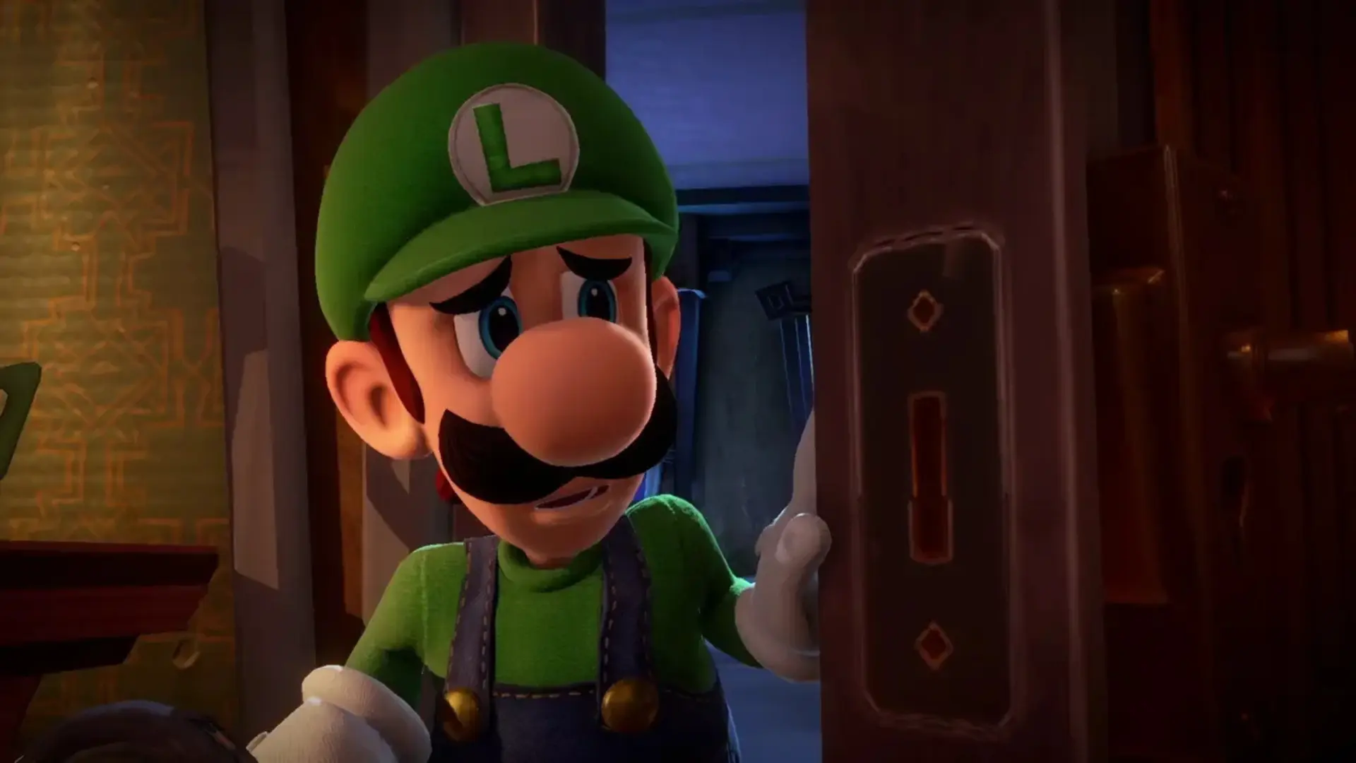Luigi cautiously opening a door in Luigi’s Mansion 3
