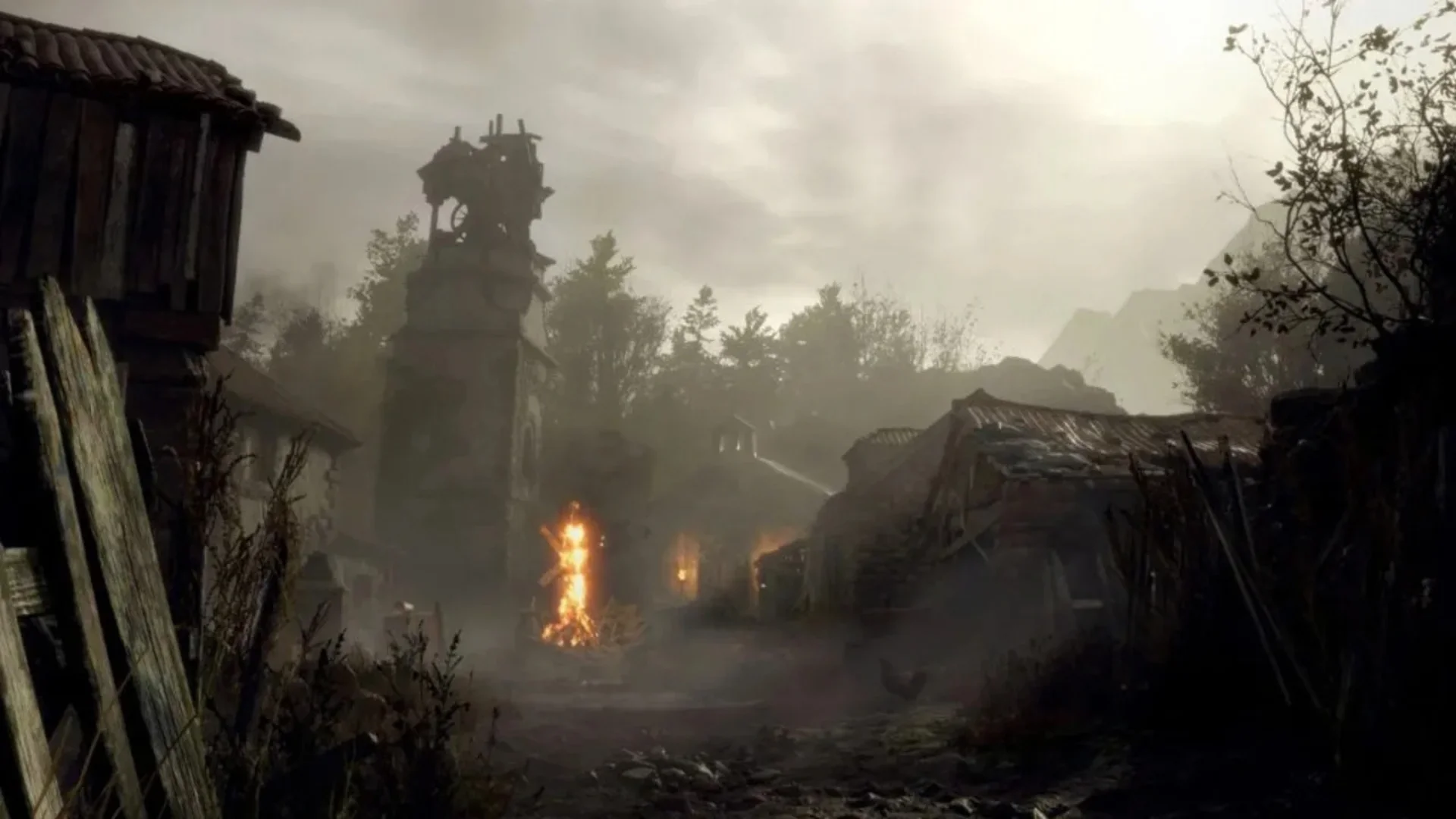 A burning pyre stands in the centre of the village in Resident Evil 4.