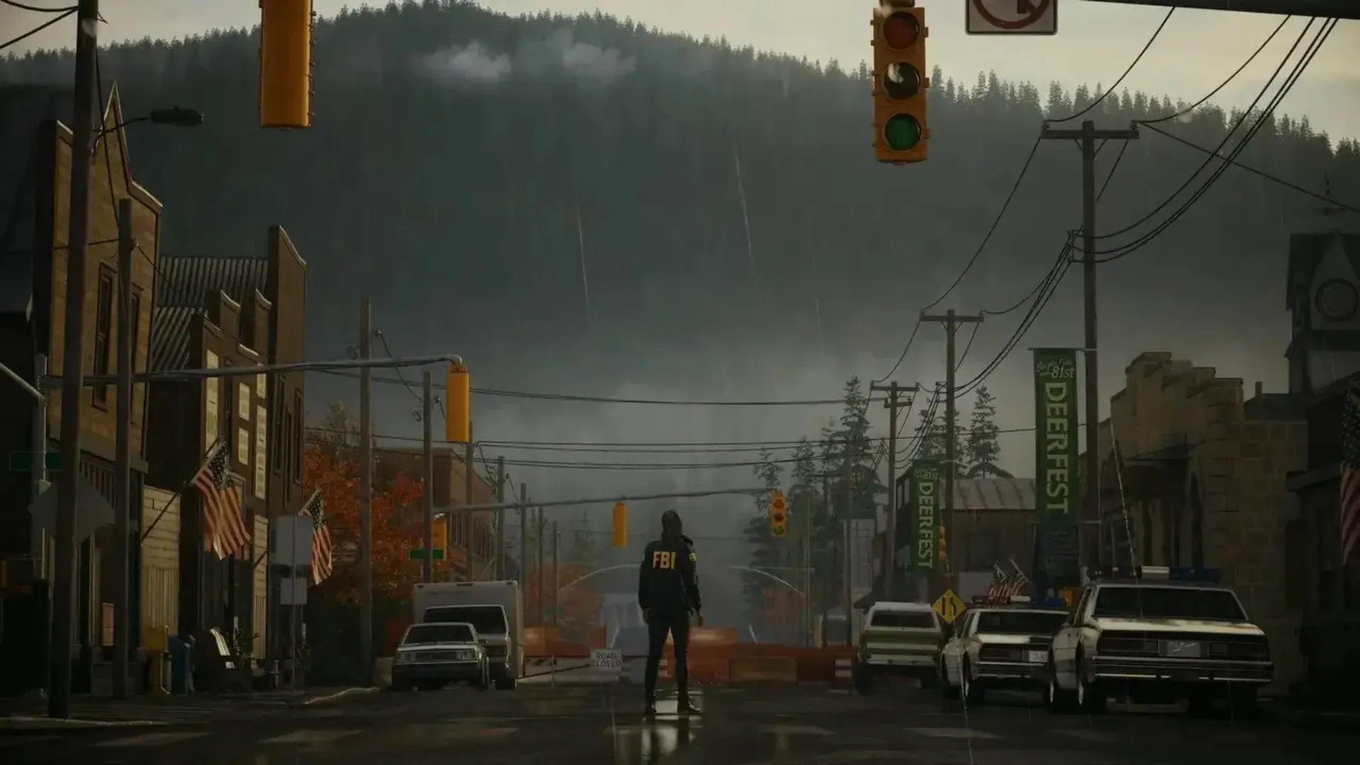 Saga Anderson stands in the middle of a rainy Bright Falls street in Alan Wake 2.