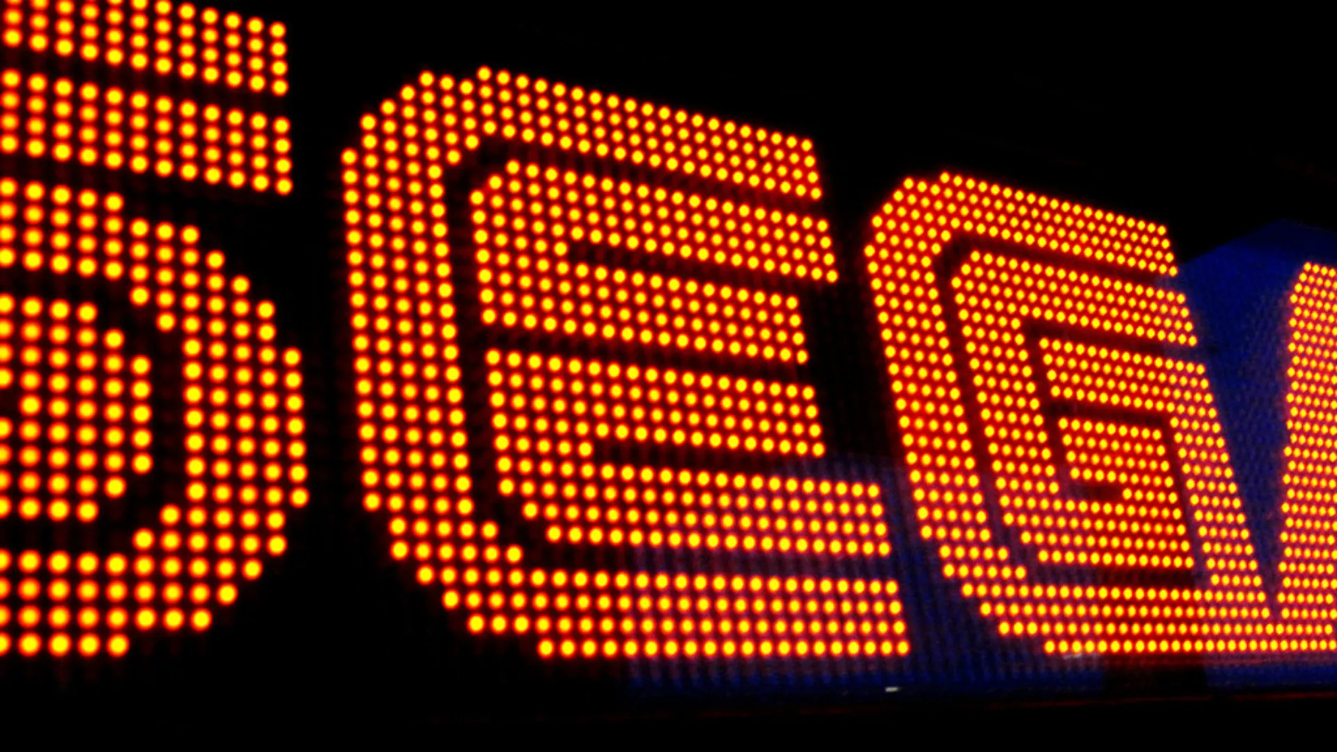 The Sega logo spelled out in glowing red and yellow dot-matrix arcade lights against a black background.